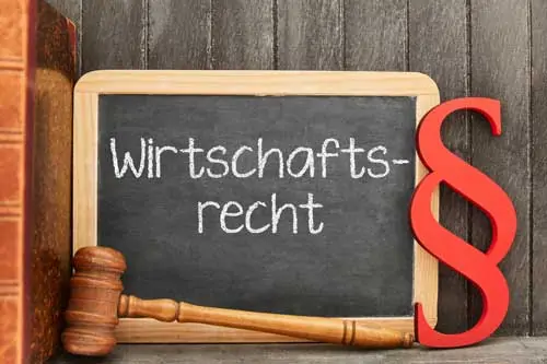 Master in Wirtschaftsrecht - German word Wirtschaftsrecht (commercial law) as concept on a blackboard